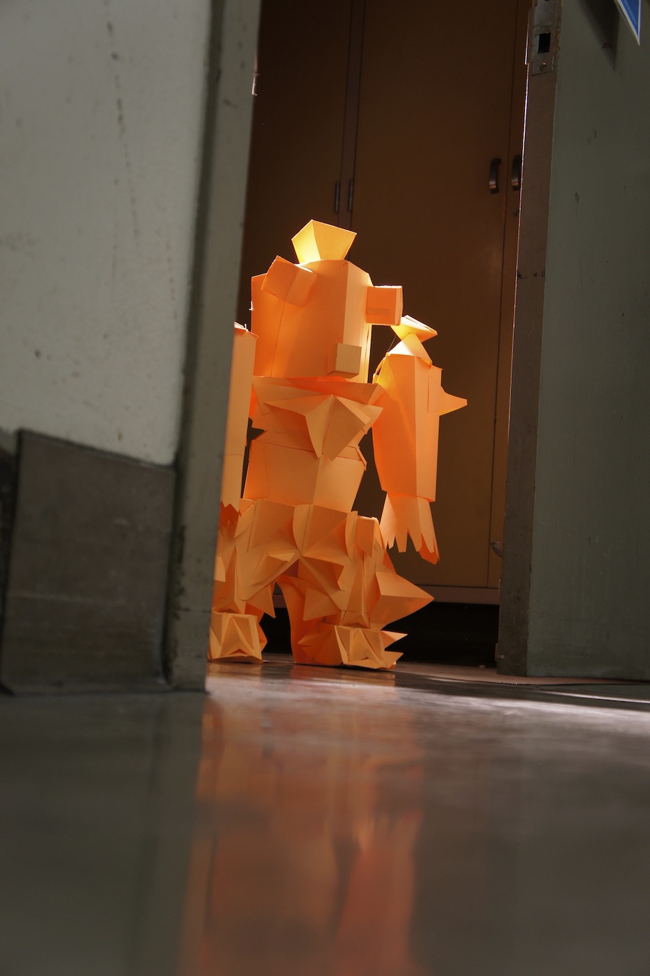 1:13 PM, Pasadena, CA. I love making things out of paper. They’re not perfect and were never meant to be. They were meant to be humble in materials and straightforward in their construction. This one is about 3 feet tall and was staged with a spotlight behind him for dramatic effect.